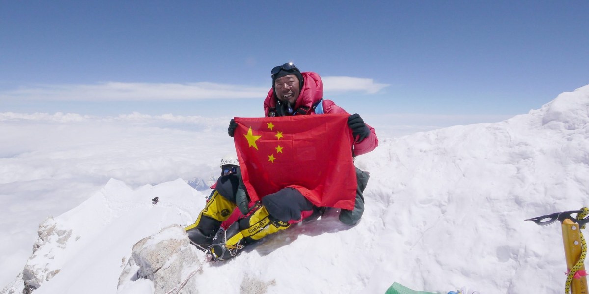 Chinese schafft den Bergsteiger-Grand Slam