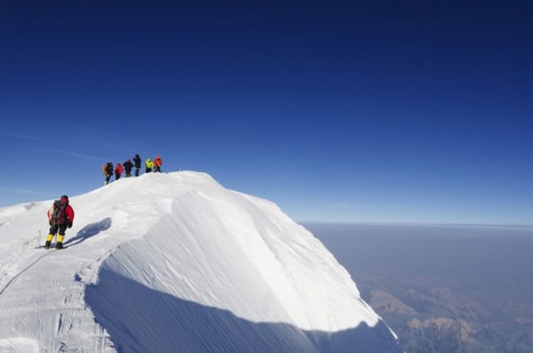 Ganz oben: Bergsteiger auf dem Gipfel des Mount McKinley (Foto: picture-alliance.com)